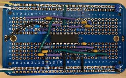 A circuit on a breadboard with an op amp and some jumper wires