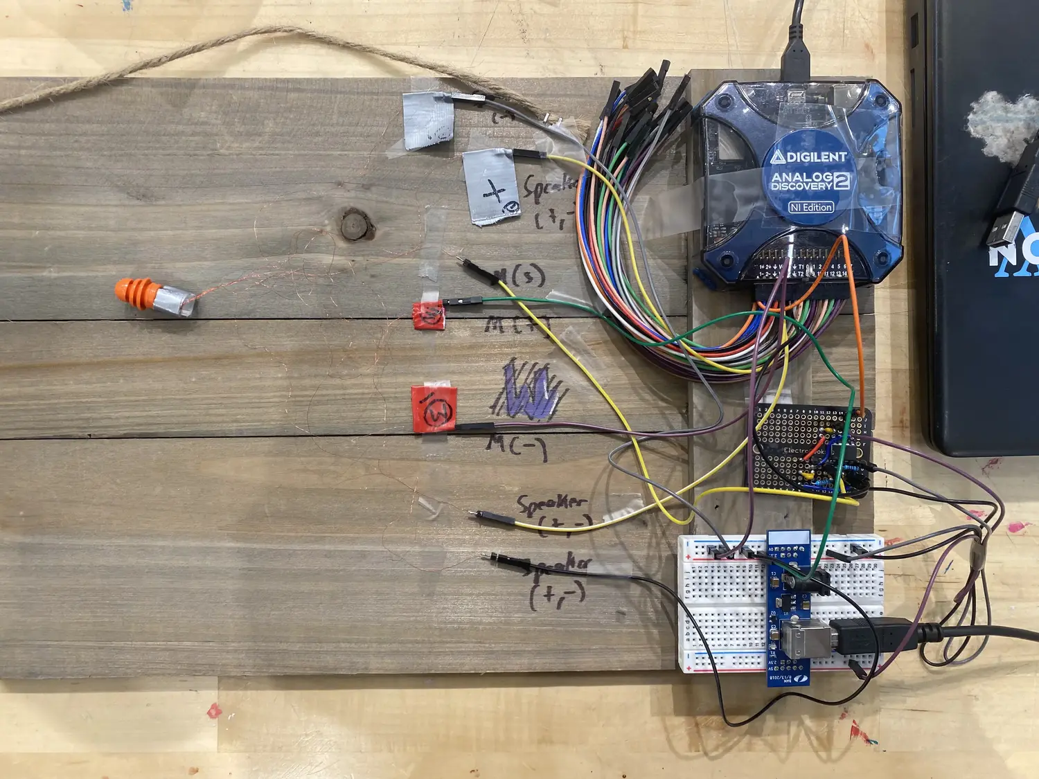 An array of components and wires on a wood table