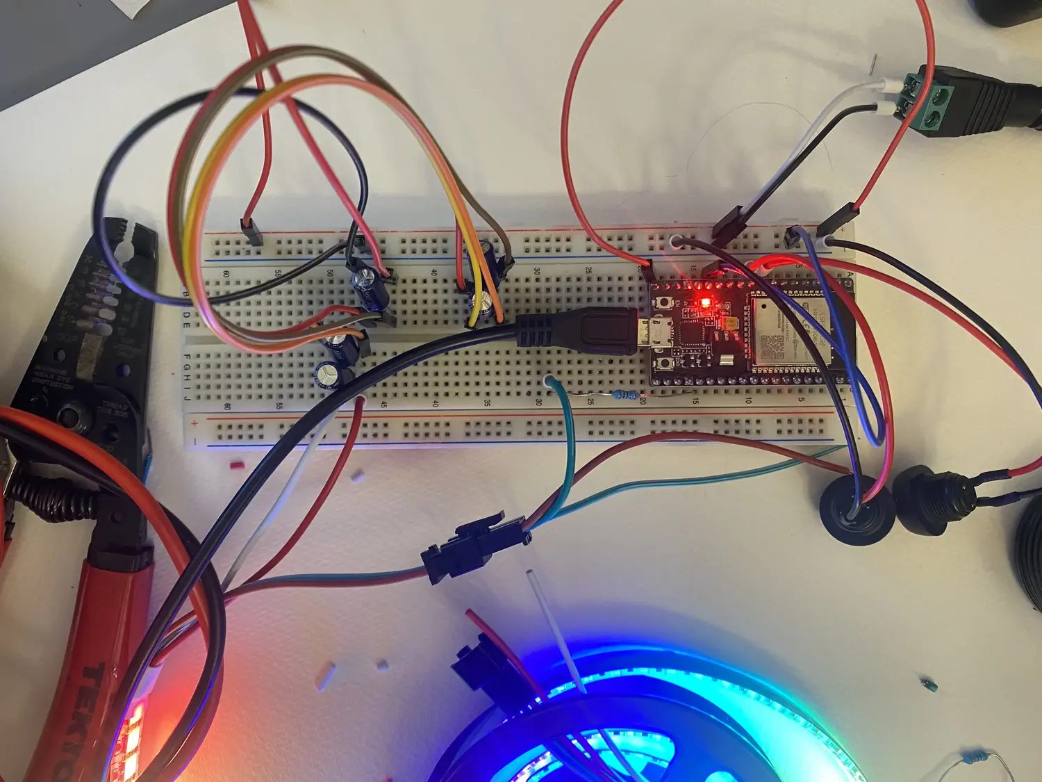 An ESP32 and some other electronics on a breadboard